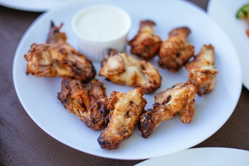 Crispy chicken wings with choice of sauce