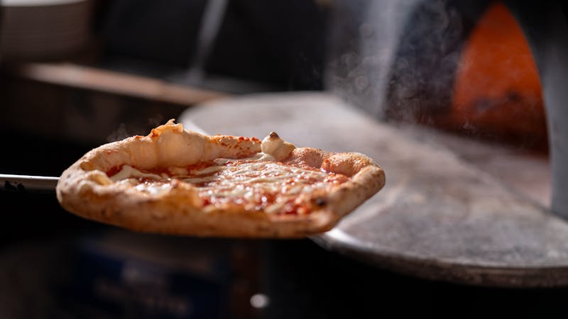 BBQ Chicken thin crust pizza with grilled chicken and BBQ sauce